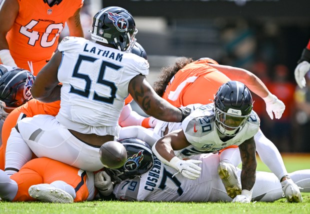 Tony Pollard (20) of the Tennessee Titans loses the ball...
