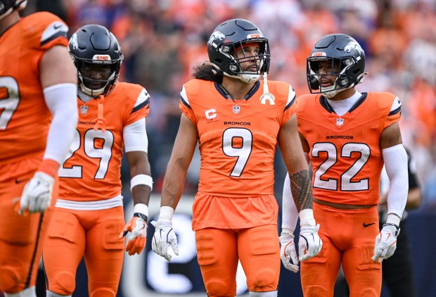 Ja'Quan McMillian (29), Talanoa Hufanga (9) and Brandon Jones (22) of the Denver Broncos prepare for Cam Ward (1) and the Tennessee Titans during the fourth quarter of the Broncos' 20-12 win at Empower Field at Mile High on Sunday, Sept. 7, 2025. (Photo by AAron Ontiveroz/The Denver Post)
