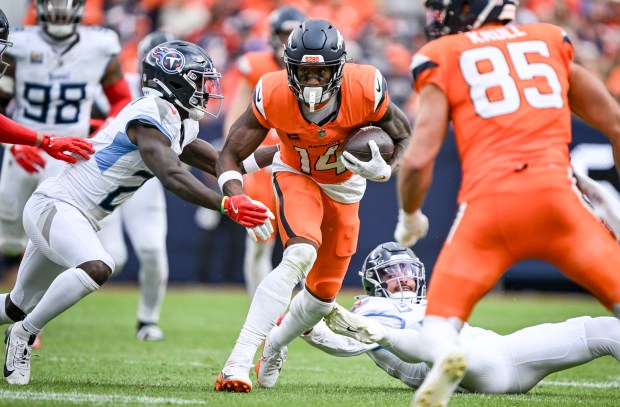 Courtland Sutton (14) of the Denver Broncos looks for space...
