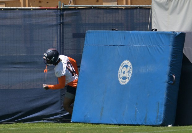 Denver Broncos cornerback Jahdae Barron (12) comes out from behind a mat during Broncos minicamp at Broncos Park in Centennial on June 10, 2025. (Photo by RJ Sangosti/The Denver Post)