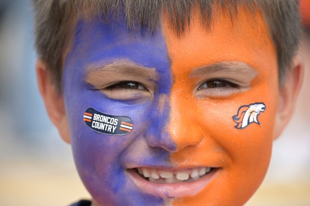 Haven Osmera, 7, celebrates opening day for the Denver Broncos...