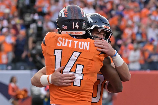 Denver Broncos Bo Nix (10) and Courtland Sutton (14) celebrate...