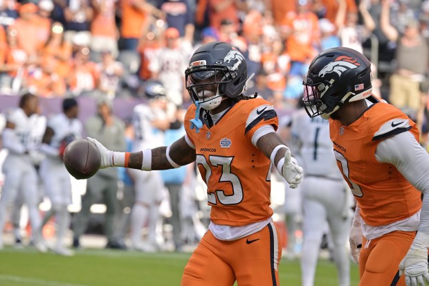 Denver Broncos Jahdae Barron (23) celebrates fumble recover in the...