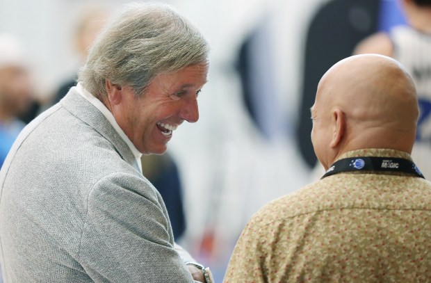 Orlando Magic chairman Dan DeVos, left, shares a moment with...