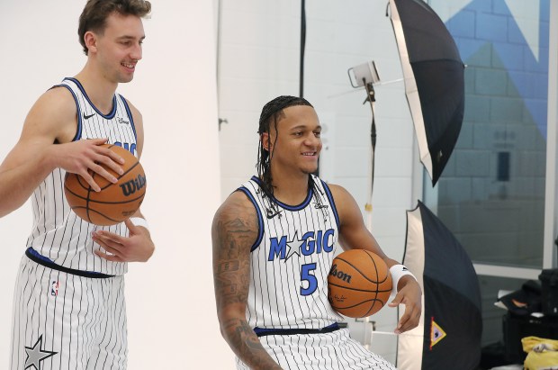 Orlando Magic forwards Franz Wagner, left, and Paolo Banchero (5)...