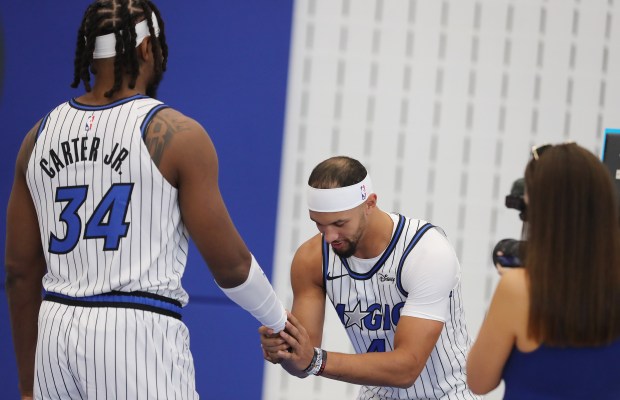 Orlando Magic guard Jalen Suggs (4) and center Wendell Carter...