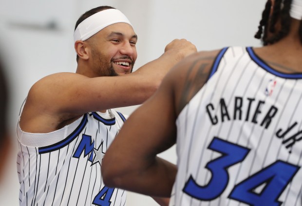 Orlando Magic guard Jalen Suggs (4) and center Wendell Carter...