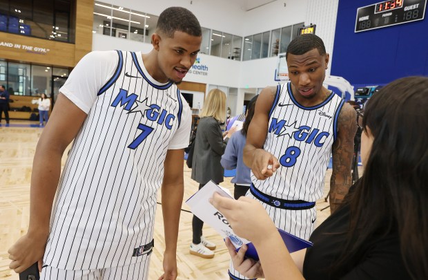 Orlando Magic center Orlando Robinson (7) and forward Jamal Cain...