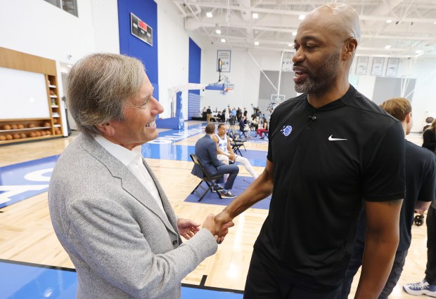 Orlando Magic chairman Dan DeVos, left, and head coach Jamahl...