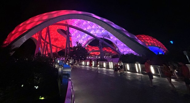 Magic Kingdom visitors experience the new look of Tron Lightcycle / Run on the first night of the roller coaster's overlay tied to "Tron: Ares," a film that debuts Oct. 10. (Dewayne Bevil/Orlando Sentinel)