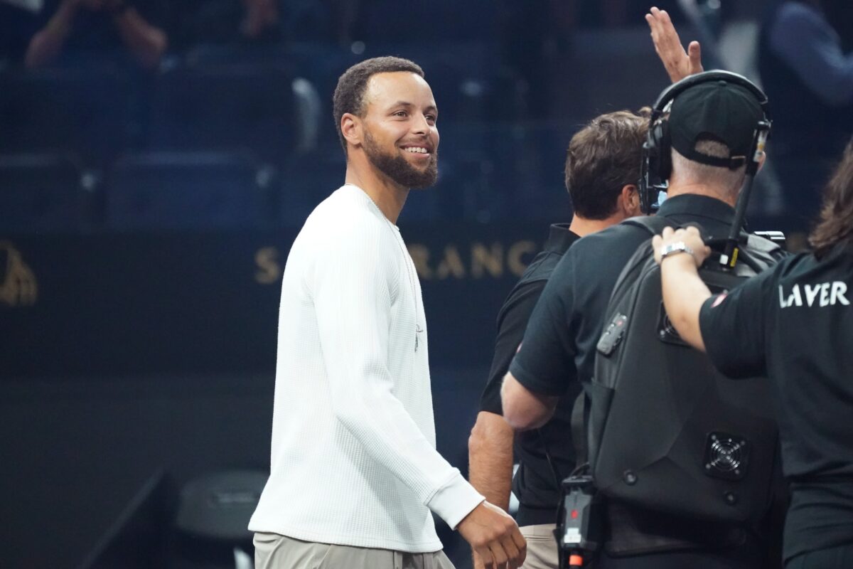 Golden State Warriors guard Stephen Curry walks to do the the coin toss at the Laver Cup at Chase Center.