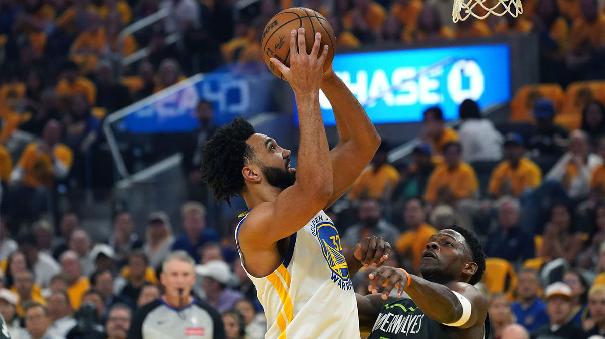 Golden State Warriors forward Trayce Jackson-Davis (32) shoots over Minnesota Timberwolves guard Anthony Edwards (5) in the first quarter during game three of the second round for the 2025 NBA Playoffs at Chase Center.