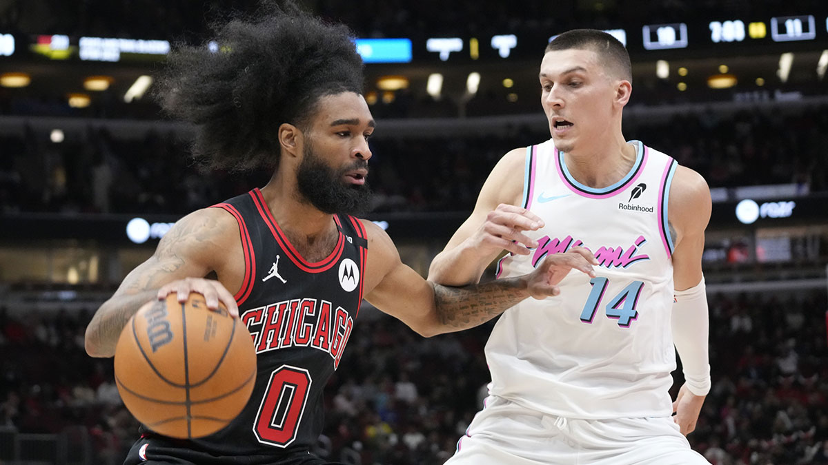 Miami Heat forward Andrew Wiggins (22) defends Chicago Bulls guard Coby White (0) during the first quarter at United Center.