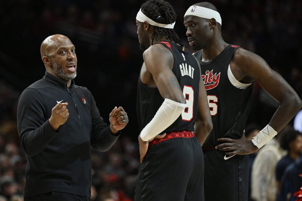 Feb 15, 2024; Portland, Oregon, USA; Portland Trail Blazers head coach Chauncey Billups talks to forward Jerami Grant (9) and center Duop Reath (26) during a break in the second half against the Minnesota Timberwolves at Moda Center. Mandatory Credit: Troy Wayrynen-USA TODAY Sports