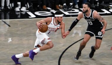 Phoenix Suns guard Devin Booker drives against Brooklyn Nets