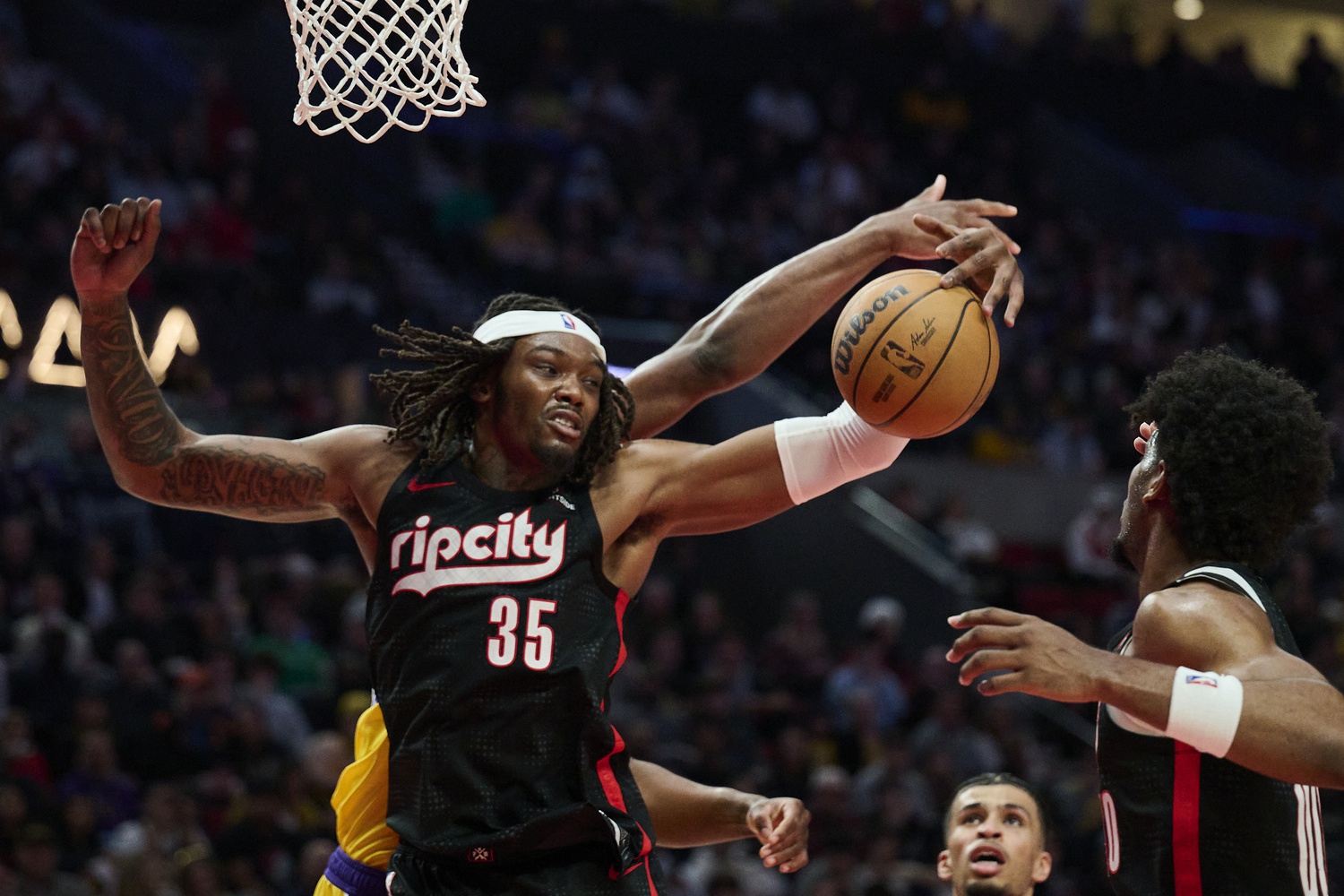 Feb 20, 2025; Portland, Oregon, USA; Portland Trail Blazers center Robert Williams III (35) grabs a rebound during the second half against the Los Angeles Lakers at Moda Center. Mandatory Credit: Troy Wayrynen-Imagn Images