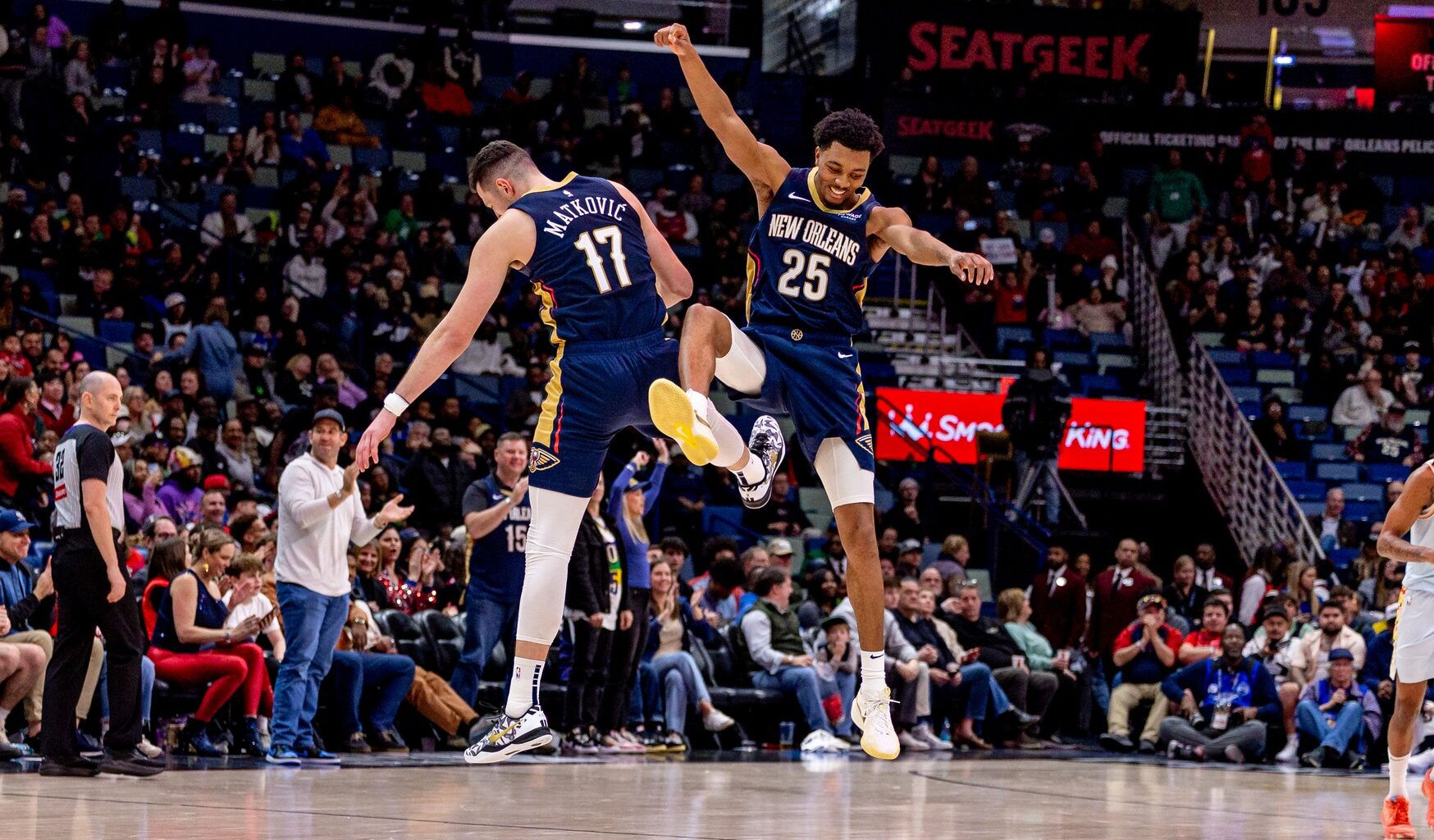 New Orleans Pelicans guard Trey Murphy III (25) celebrates making a three point basket with center Karlo Matkovic