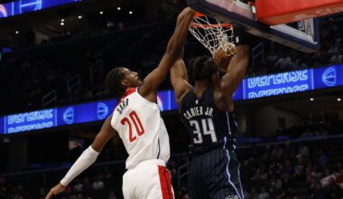 Apr 3, 2025; Washington, District of Columbia, USA; Orlando Magic center Wendell Carter Jr. (34) dunks the ball as Washington Wizards forward Alex Sarr (20) defends in the first half at Capital One Arena. Mandatory Credit: Geoff Burke-Imagn Images