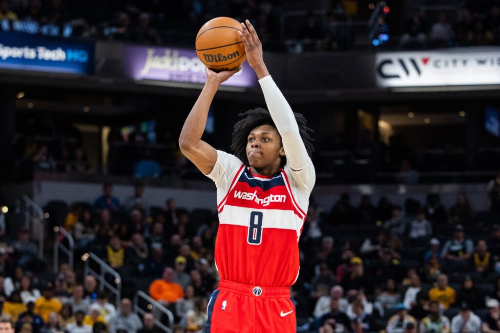 Apr 8, 2025; Indianapolis, Indiana, USA; Washington Wizards guard Bub Carrington (8) shoots the ball in the second half against the Indiana Pacers at Gainbridge Fieldhouse. Mandatory Credit: Trevor Ruszkowski-Imagn Images