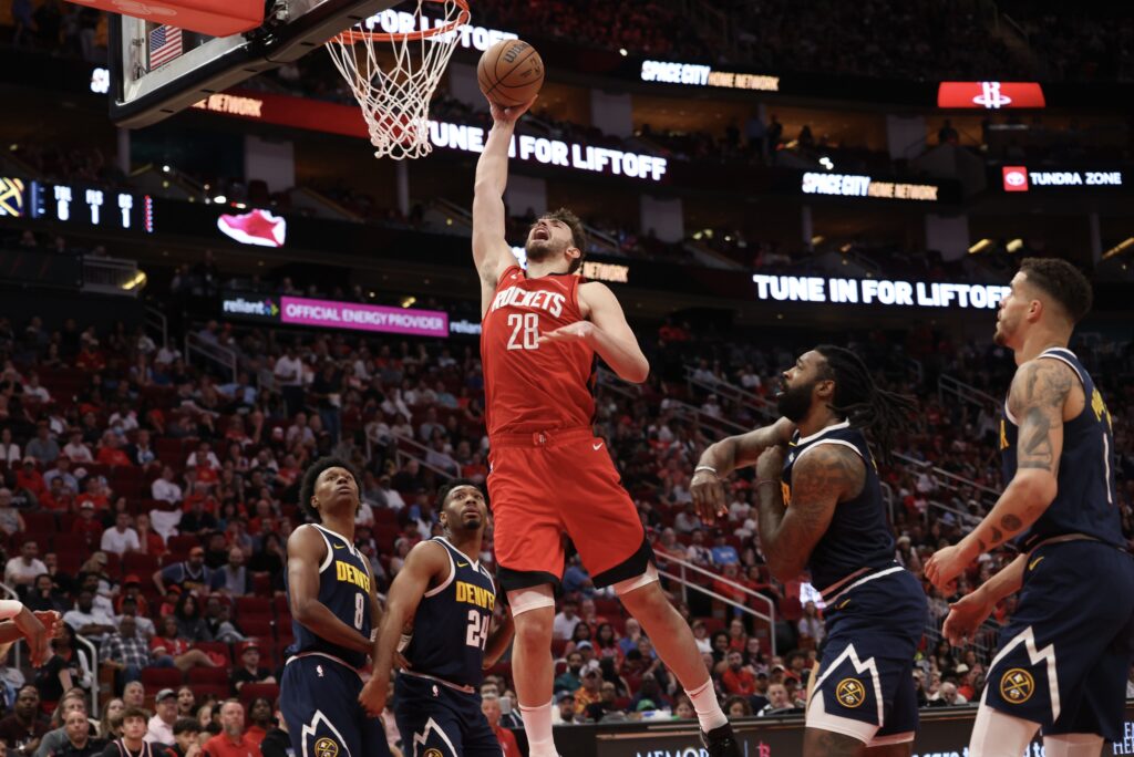 Apr 13, 2025; Houston, Texas, USA; Houston Rockets center Alperen Sengun (28) dunks against the Denver Nuggets in the second quarter at Toyota Center. Mandatory Credit: Thomas Shea-Imagn Images
