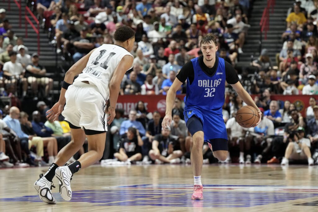 Jul 12, 2025; Las Vegas, NV, USA; Dallas Mavericks forward Cooper Flagg (32) dribbles against San Antonio Spurs forward Carter Bryant (11) in the fourth quarter of their game at Thomas & Mack Center. Mandatory Credit: Candice Ward-Imagn Images
