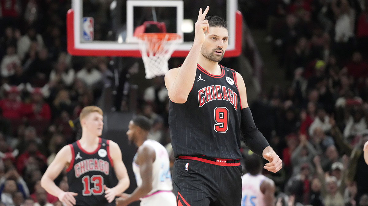 Chicago Bulls center Nikola Vucevic (9) reacts after making a three point basket against the Miami Heat during the second half at United Center.