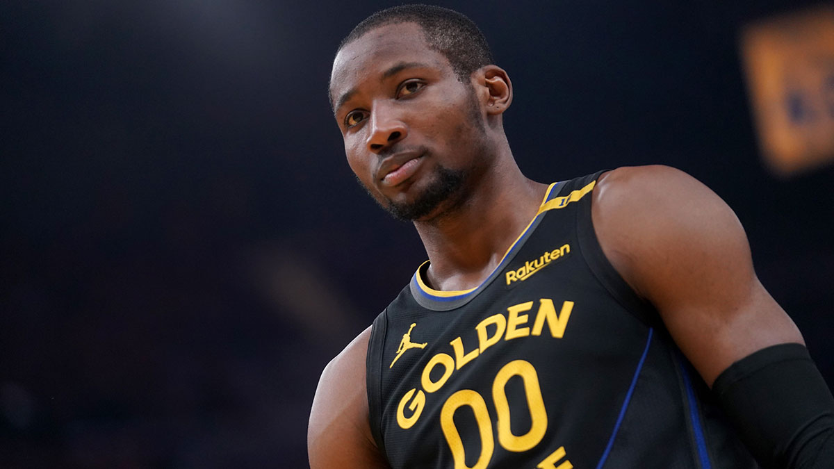 Warriors forward Jonathan Kuminga (00) stands on the court before a play against the Minnesota Timberwolves in the second quarter during game four of the second round for the 2025 NBA Playoffs at Chase Center with Warriors head coach Steve Kerr and Tim MacMahon in the background