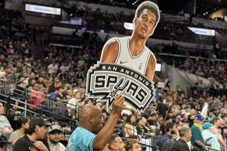 A fan holds up a cutout of No. 1 NBA Draft pick Victor Wembanyama at the Spurs’ draft watch party at the AT&T Center.