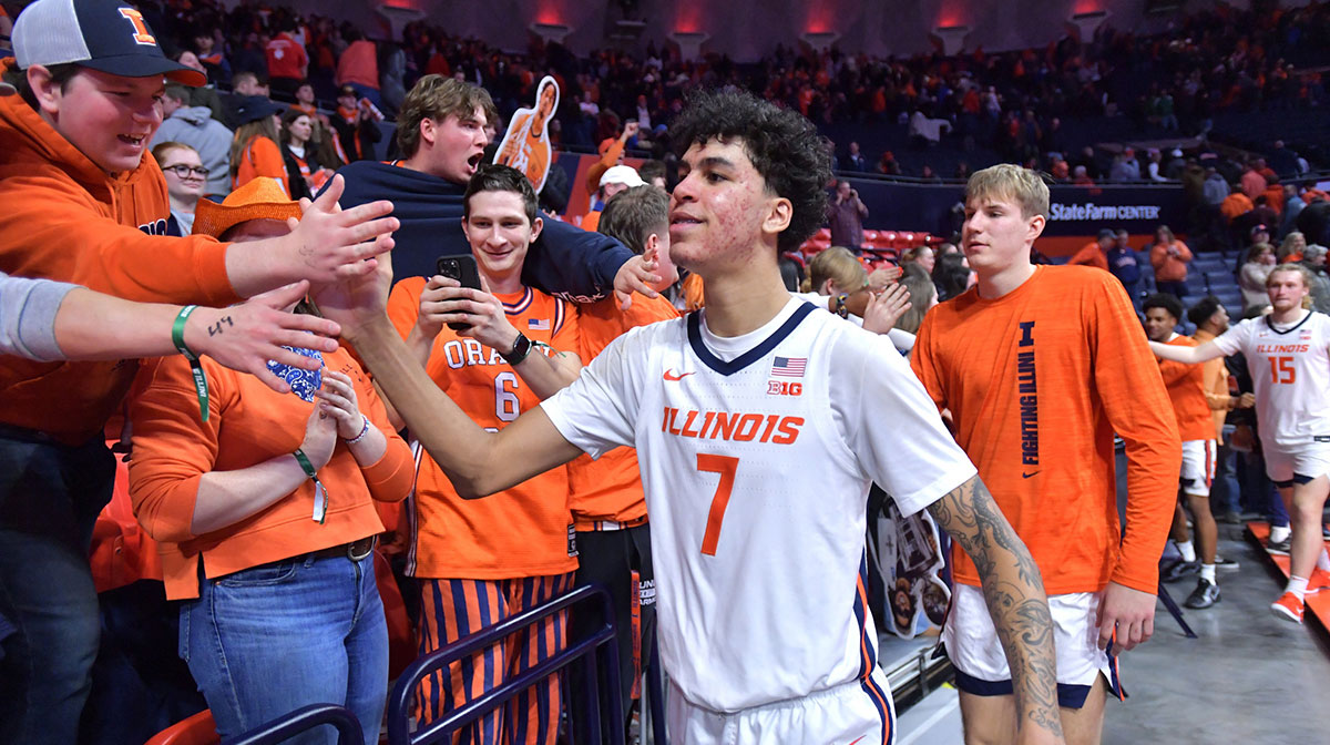 Illinois Fighting Illini forward Will Riley (7) and teammates get a hand from the fans after a 83-78 win over the UCLA Bruins at State Farm Center.