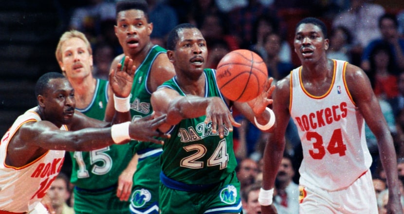 Dallas Mavericks forward Mark Aguirre (24) passes the ball as Houston Rockets forward...