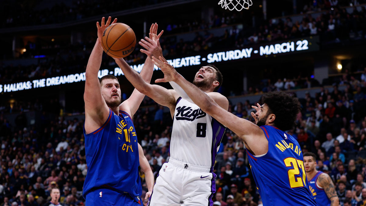Mar 5, 2025; Denver, Colorado, USA; Sacramento Kings guard Zach LaVine (8) battles for a rebound with Denver Nuggets center Nikola Jokic (15) and guard Jamal Murray (27) in the third quarter at Ball Arena. 