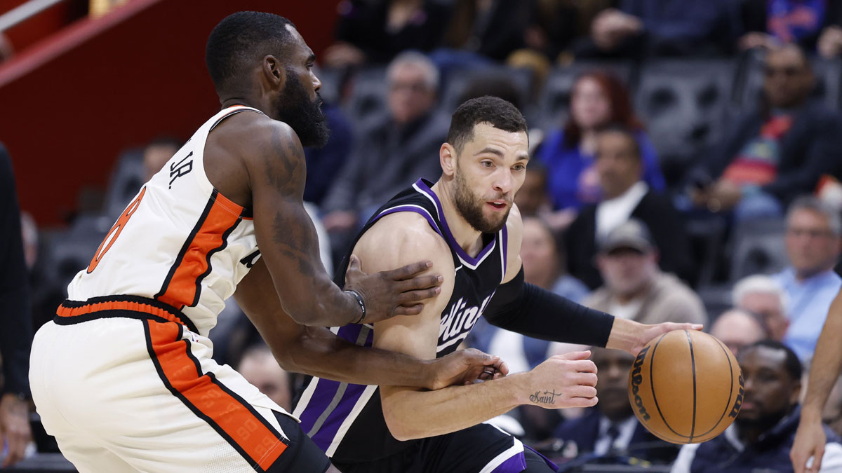 Sacramento Kings guard Zach LaVine (8) dribbles defended by Detroit Pistons forward Tim Hardaway Jr. (8) in the first half at Little Caesars Arena.