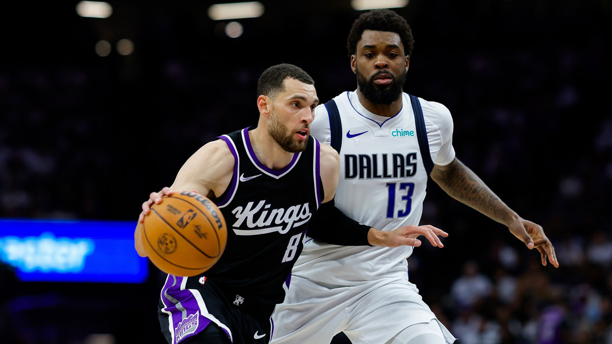 Sacramento Kings guard Zach LaVine (8) dribbles the ball against Dallas Mavericks forward Naji Marshall (13) during the fourth quarter at Golden 1 Center.