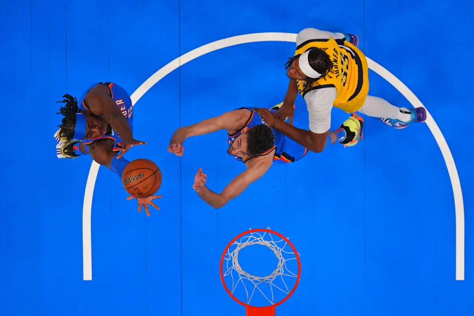 Jun 8, 2025; Oklahoma City, Oklahoma, USA; Oklahoma City Thunder guard Luguentz Dort (5) and forward Chet Holmgren (7) reaches for the ball against Indiana Pacers center Myles Turner (33) during the first quarter during game two of the 2025 NBA Finals at Paycom Center. Mandatory Credit: Kyle Terada-Imagn Images