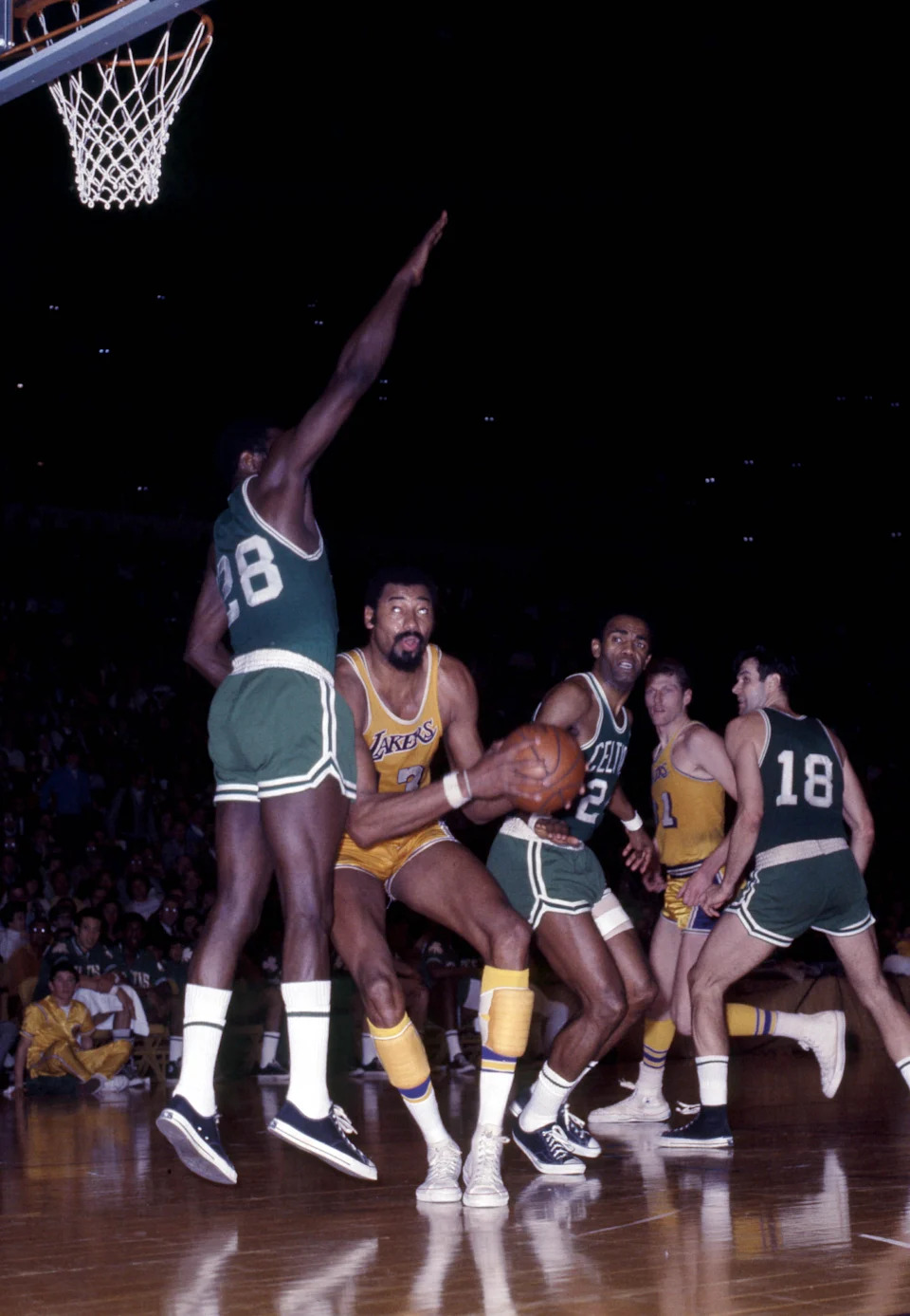 Unknown date; Los Angeles, CA, USA: FILE PHOTO; Los Angeles Lakers center Wilt Chamberlain (13) is defended by Boston Celtics center Jim Barnes (28) at The Forum. Mandatory Credit: Darryl Norenberg-USA TODAY Sports