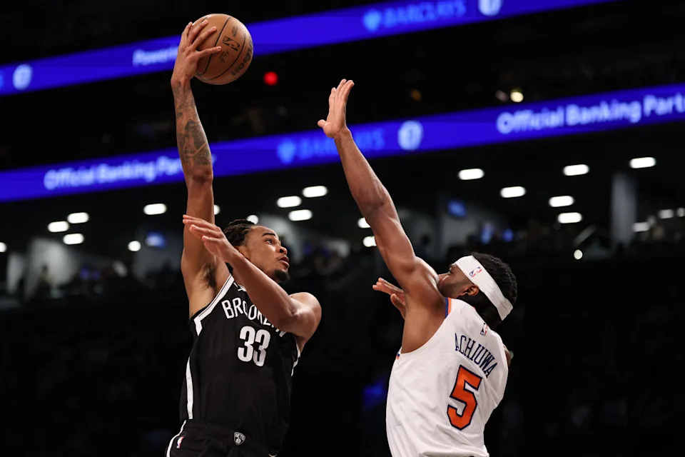 Apr 13, 2025; Brooklyn, New York, USA; Brooklyn Nets center Nic Claxton (33) goes to the basket after the game New York Knicks forward Precious Achiuwa (5) during the second half at Barclays Center. Mandatory Credit: Vincent Carchietta-Imagn Images