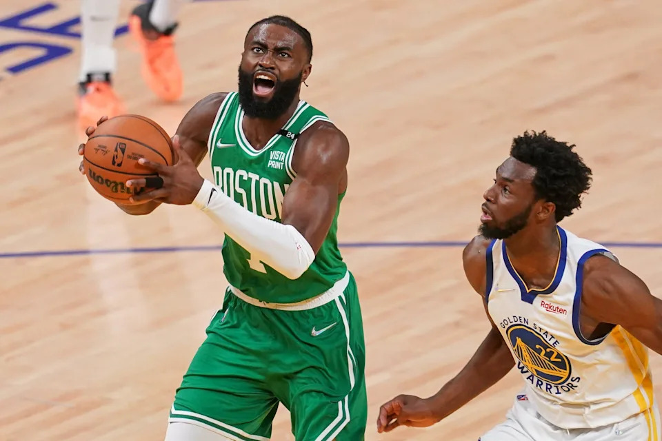 Jun 2, 2022; San Francisco, California, USA; Boston Celtics guard Jaylen Brown (7) drives to the basket against Golden State Warriors forward Andrew Wiggins (22) during the second half of game one of the 2022 NBA Finals at Chase Center. Mandatory Credit: Cary Edmondson-USA TODAY Sports