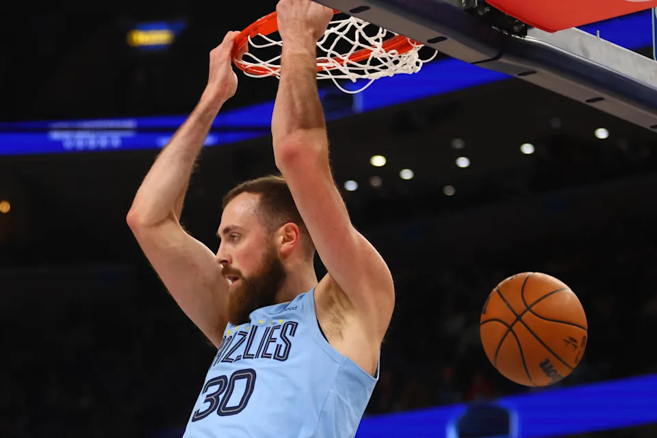 Jan 22, 2025; Memphis, Tennessee, USA; Memphis Grizzlies center Jay Huff (30) dunks during the third quarter against the Charlotte Hornets at FedExForum. Mandatory Credit: Petre Thomas-Imagn Images