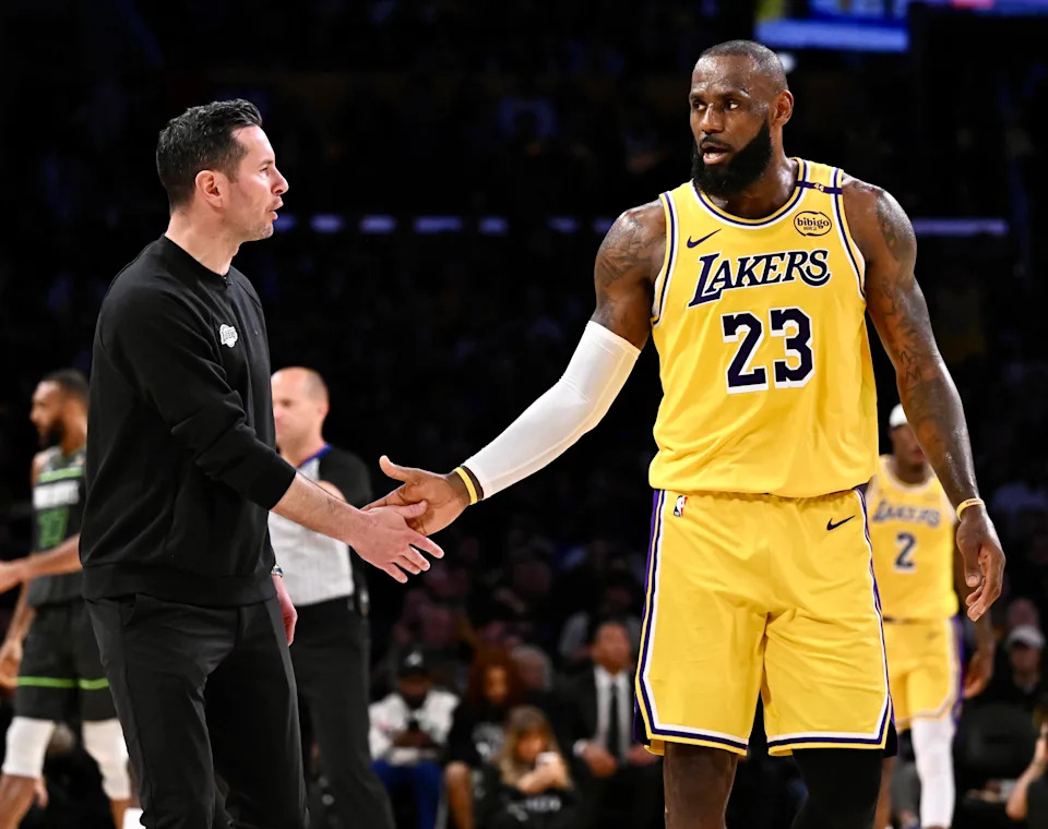 Los Angeles, CA - April 30: Head coach JJ Redick of the Los Angeles Lakers high fives LeBron #23 of the Los Angeles Lakers
in the first half of game 5 of a first round NBA basketball game against the Minnesota Timberwolves
at Crypto.com Arena in Los Angeles on Wednesday, April 30, 2025. (Photo by Keith Birmingham/MediaNews Group/Pasadena Star-News via Getty Images)