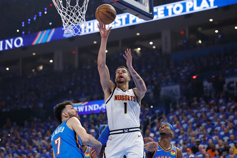 May 18, 2025; Oklahoma City, Oklahoma, USA; Denver Nuggets forward Michael Porter Jr. (1) shoots beside Oklahoma City Thunder forward Chet Holmgren (7) in the first quarter during game seven of the second round for the 2025 NBA Playoffs at Paycom Center. Mandatory Credit: Alonzo Adams-Imagn Images