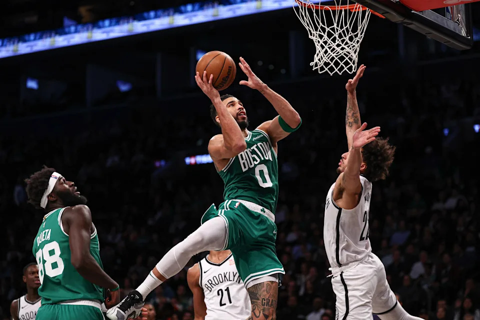 Nov 13, 2024; Brooklyn, New York, USA; Brooklyn Nets forward Dariq Whitehead (0) goes to the basket as Brooklyn Nets forward Jalen Wilson (22) defends during the first half at Barclays Center. Mandatory Credit: Vincent Carchietta-Imagn Images