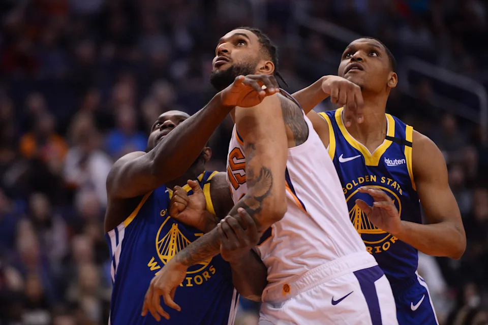 Feb 12, 2020; Phoenix, Arizona, USA; Phoenix Suns forward Jonah Bolden (43) and Golden State Warriors forward Eric Paschall (7) and guard Zach Norvell Jr. (21) battle for rebounding position during the first half at Talking Stick Resort Arena. Mandatory Credit: Joe Camporeale-USA TODAY Sports