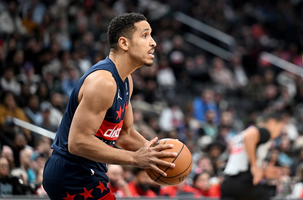 Malcolm Brogdon #15 of the Washington Wizards passes the ball against the Charlotte Hornets at Capital One Arena on December 26, 2024 in Washington, DC. 
