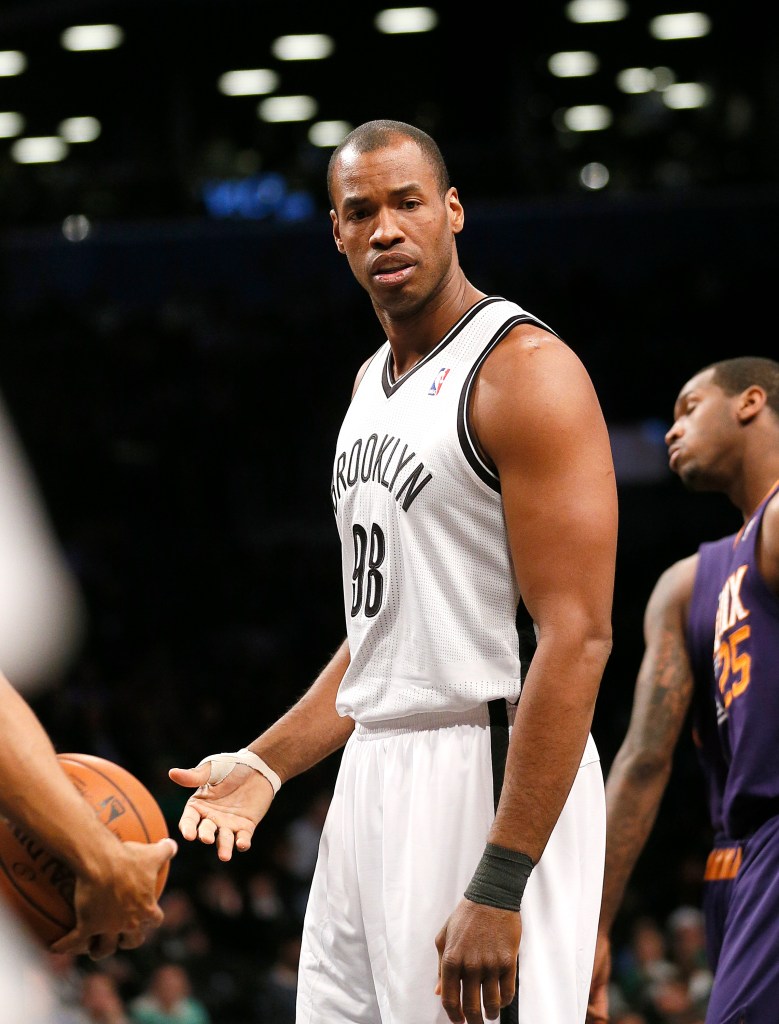Jason Collins #98 of the Brooklyn Nets reacts to a foul call during the fourth quarter. The Nets defeated the Suns 108-95 in an NBA basketball game at the Barclay Center on March 17, 2014. 