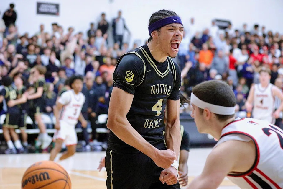 Sherman Oaks Notre Dame's Tyran Stokes celebrates after a slam dunk against Harvard-Westlake.