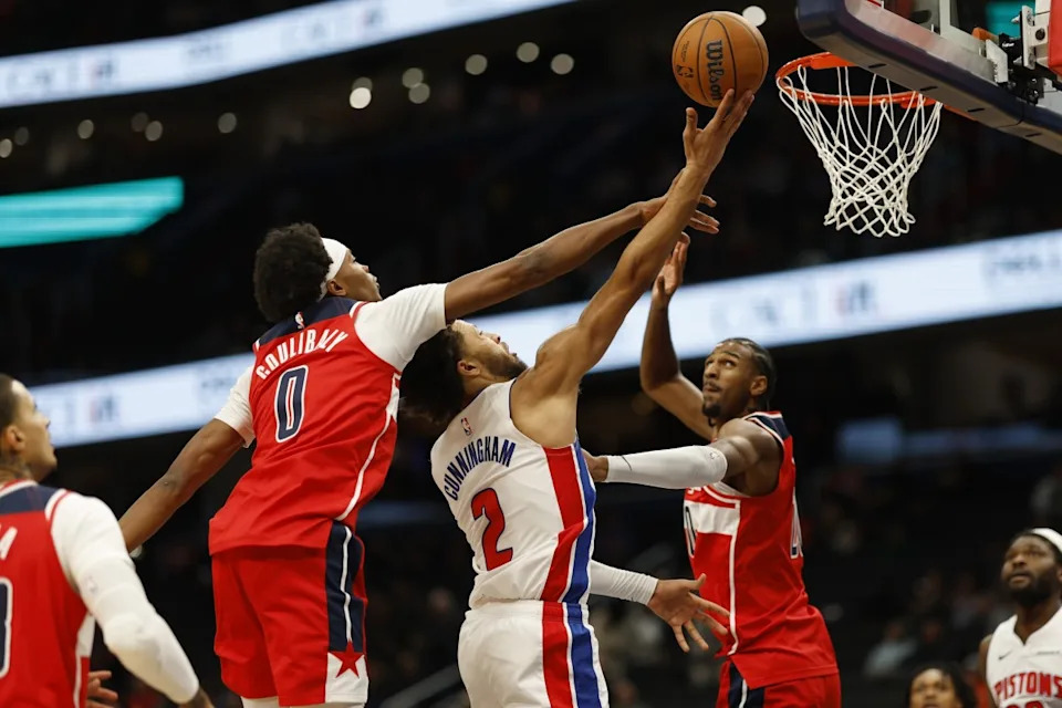 Detroit Pistons guard Cade Cunningham (2) shoots the ball as Washington Wizards guard Bilal Coulibaly (0) and Wizards forward Alexandre Sarr (20)Geoff Burke-Imagn Images