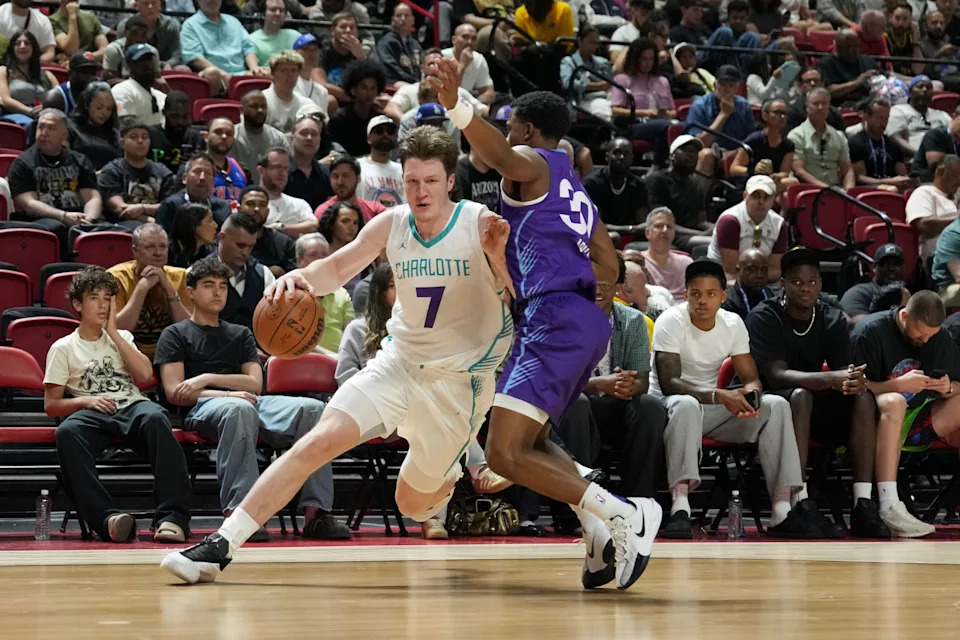 LAS VEGAS, NEVADA - JULY 11: Kon Knueppel #7 of the Charlotte Hornets drives past Max Abmas #30 of the Utah Jazz in the second half of a 2025 NBA Summer League game at the Thomas & Mack Center on July 11, 2025 in Las Vegas, Nevada. The Hornets defeated the Jazz 111-105. NOTE TO USER: User expressly acknowledges and agrees that, by downloading and or using this photograph, User is consenting to the terms and conditions of the Getty Images License Agreement. (Photo by Candice Ward/Getty Images)