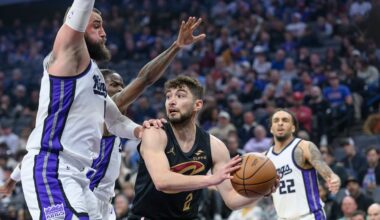Cleveland Cavaliers guard Ty Jerome (2) is guarded by Sacramento Kings center Jonas Valanciunas, left, during the second half of an NBA basketball game in Sacramento, Calif., Wednesday, March 19, 2025. (AP Photo/Randall Benton)