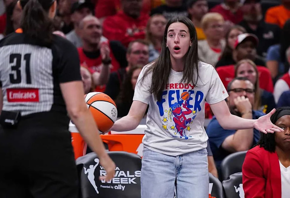 Indiana Fever guard Caitlin Clark (22) reacts to a call from the referee Tuesday, Aug. 12, 2025, during the game at Gainbridge Fieldhouse in Indianapolis. The Dallas Wings defeated the Indiana Fever, 81-80.