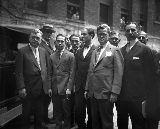 Judge John R. Caverly, from left, Nathan Leopold Jr., Richard Loeb, Atty. Robert E. Crowe and Sam Ettelson in the jail yard in 1924. (Chicago Herald and Examiner) 